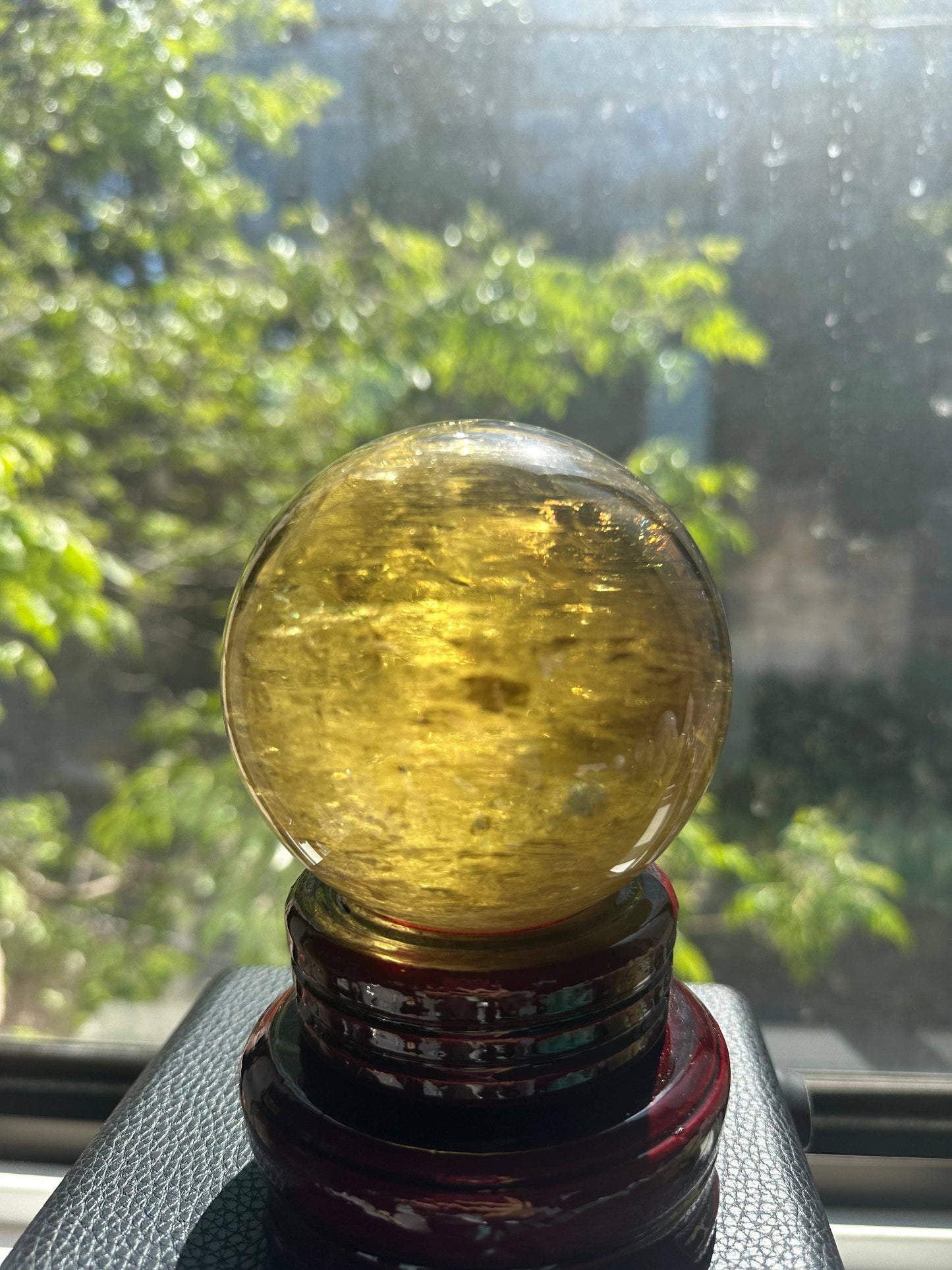 Light Yellow Green Hue Citrine Sphere with Rainbow Inclusion