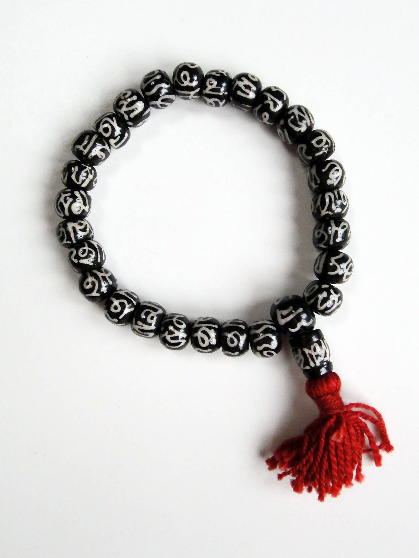 Hand Carved Mala Bracelet with Batik Bone Beads (Om Inscription)