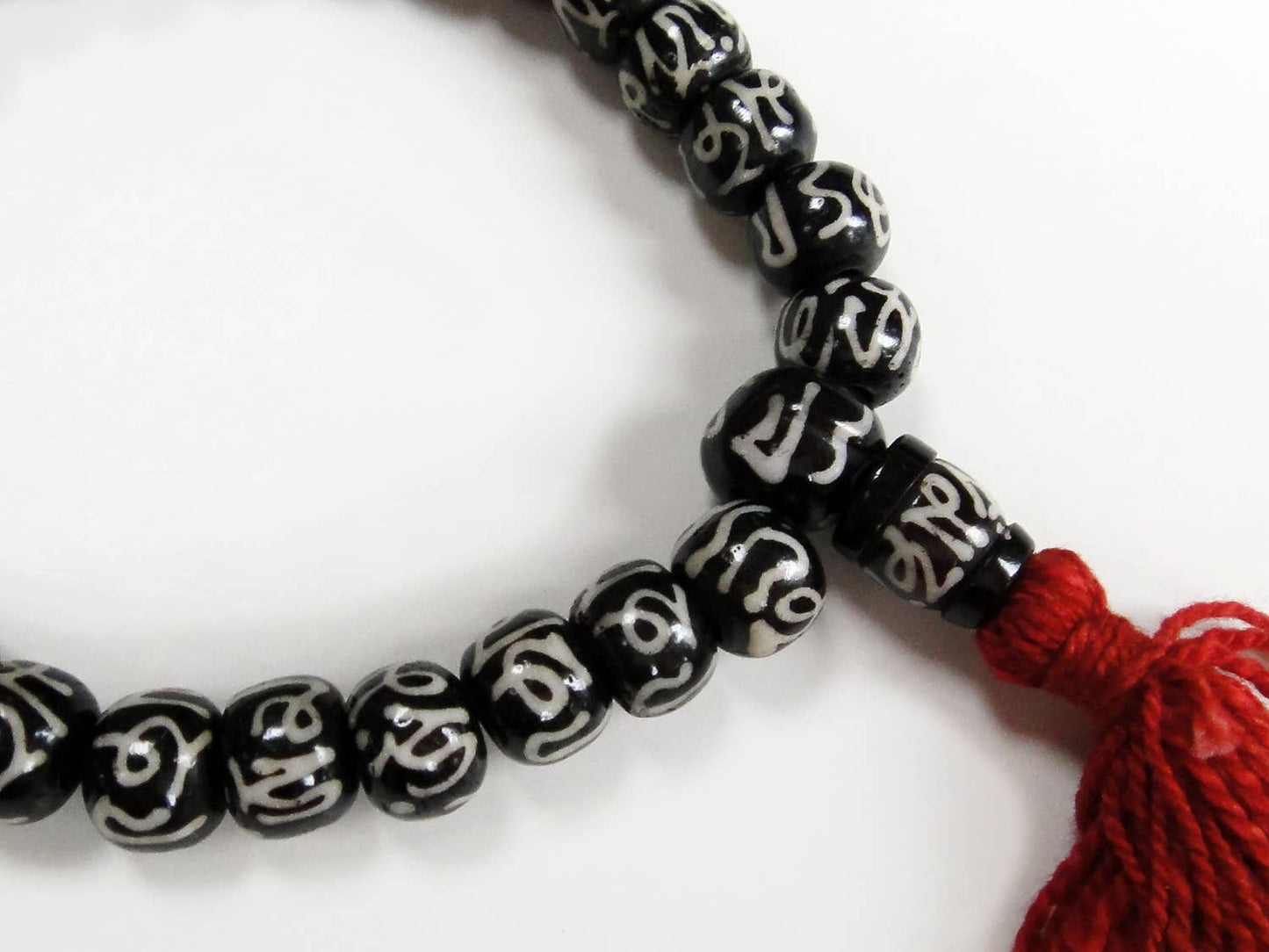 Hand Carved Mala Bracelet with Batik Bone Beads (Om Inscription)